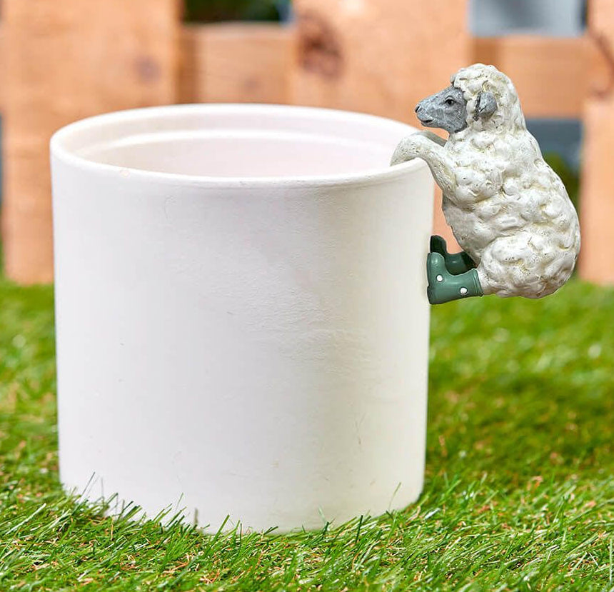 Cute sheep plant pot hugger garden accessory, fun animal decoration for indoor plants and outdoor pots, perfect novelty gift for plant lovers.