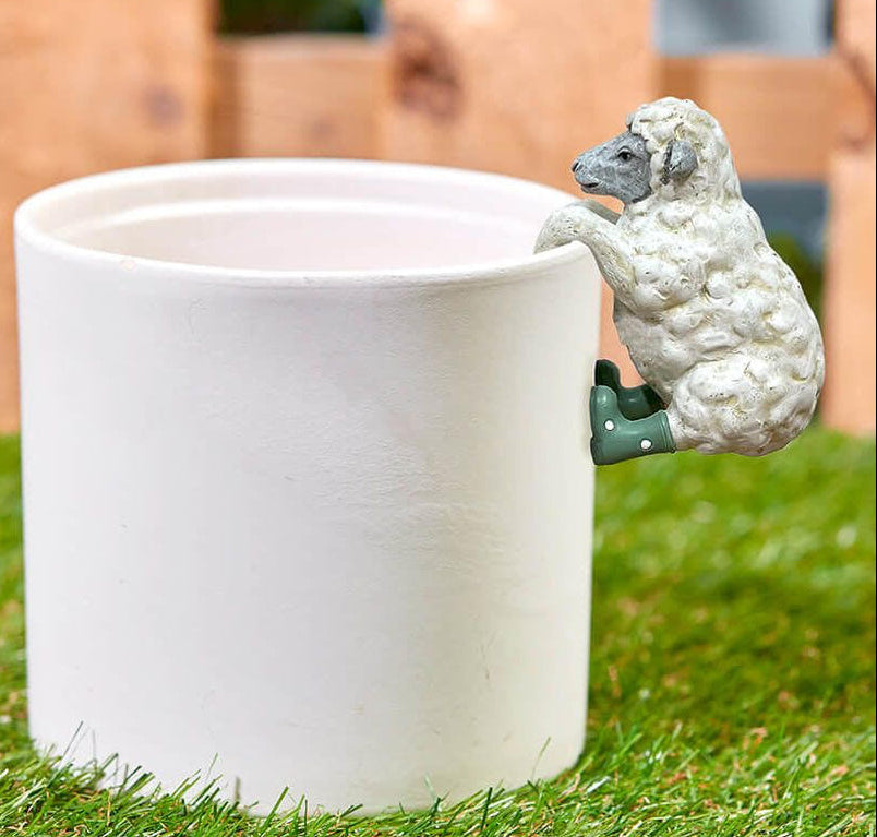 Cute sheep plant pot hugger garden accessory, fun animal decoration for indoor plants and outdoor pots, perfect novelty gift for plant lovers.