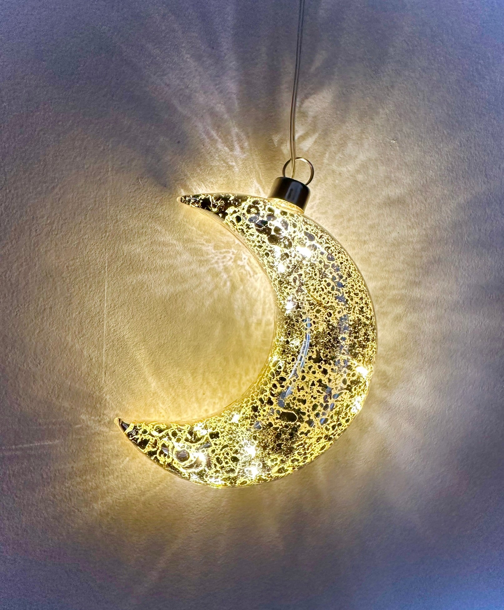 Golden crescent moon hanging LED light decoration, battery powered with warm glow for home, garden party lighting, or christmas