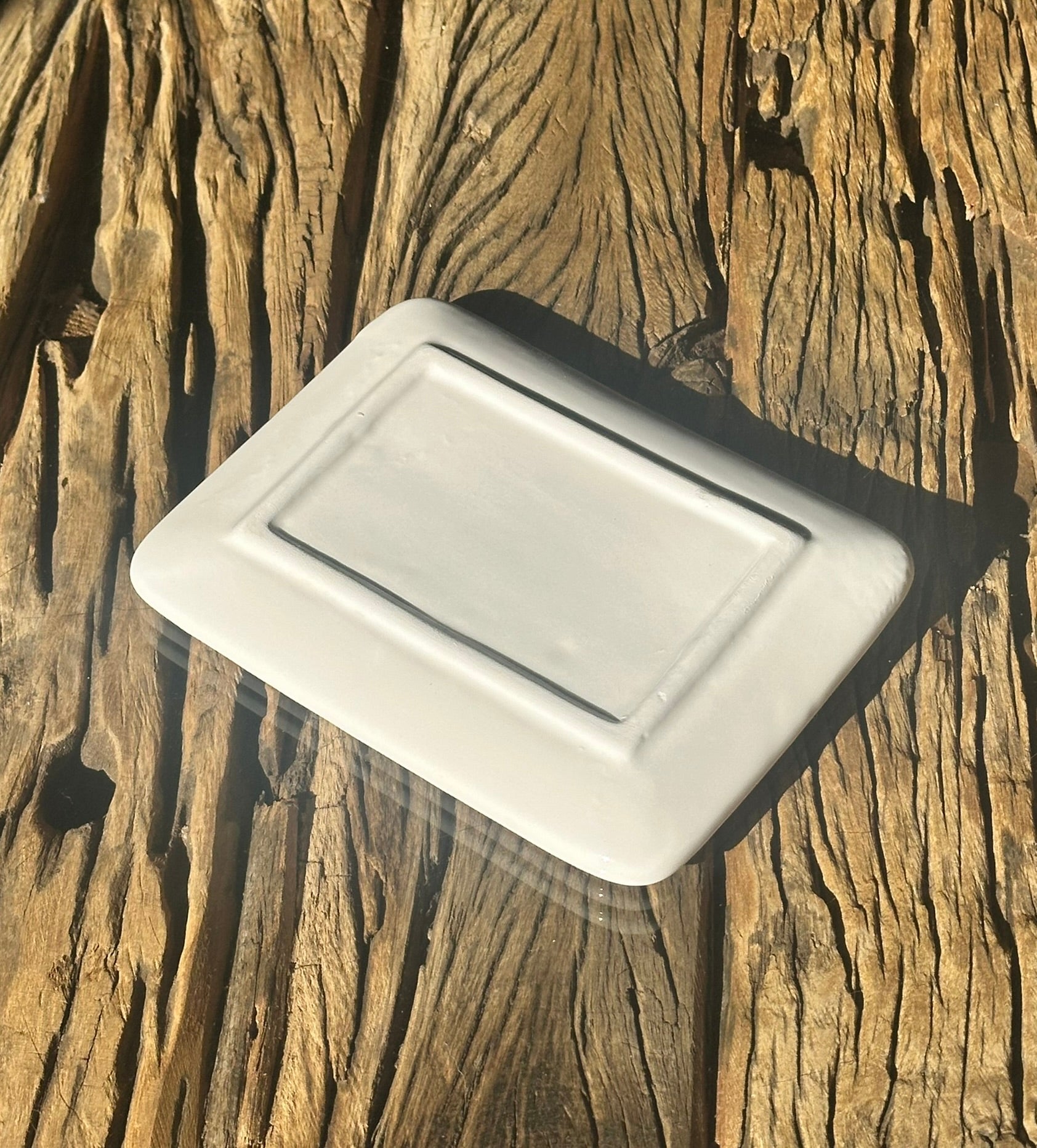 Highland cow ceramic dish resting on a wood surface, perfect for holding rings or keys