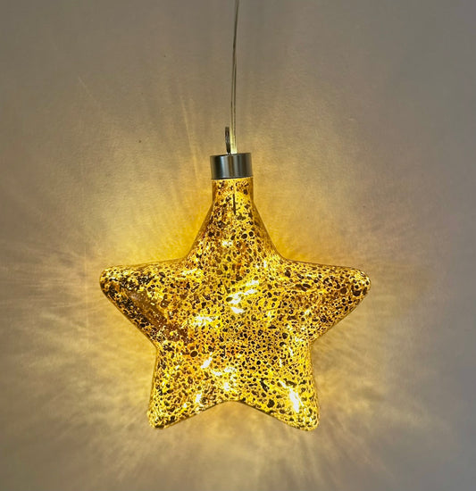 Illuminative bronze star glass hanging decoration glowing with warm festive light, perfect Christmas tree or home décor piece and elegant gift for her.