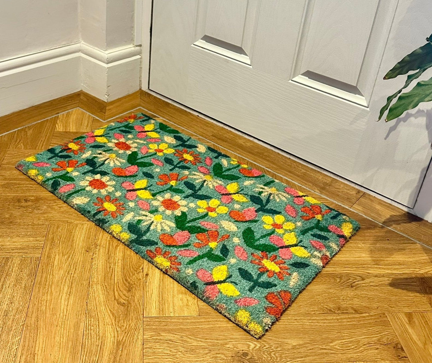 staged image of the vibrant floral doormat