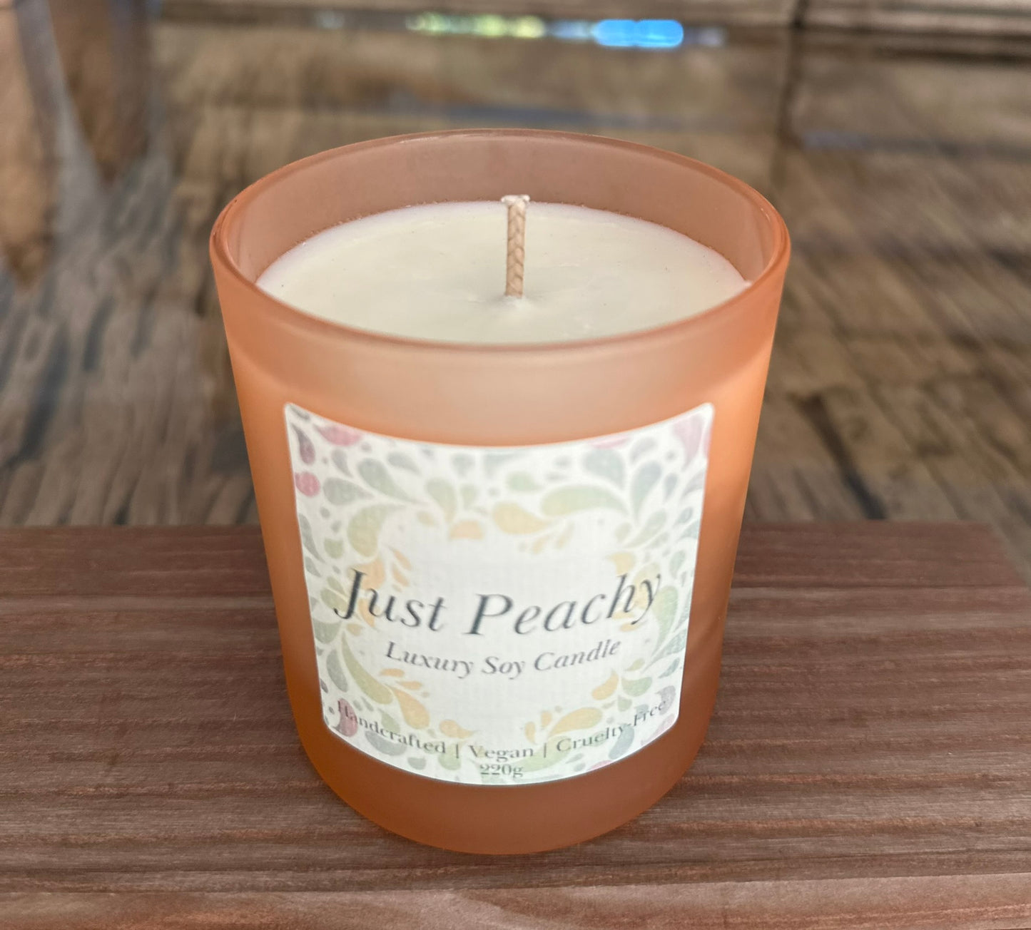 just peachy scented candle in frosted glass peach coloured glass.