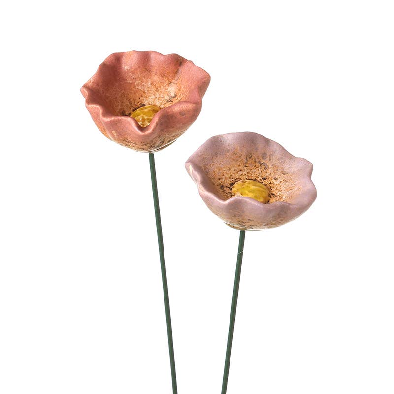 Two decorative ceramic flower stakes on white background