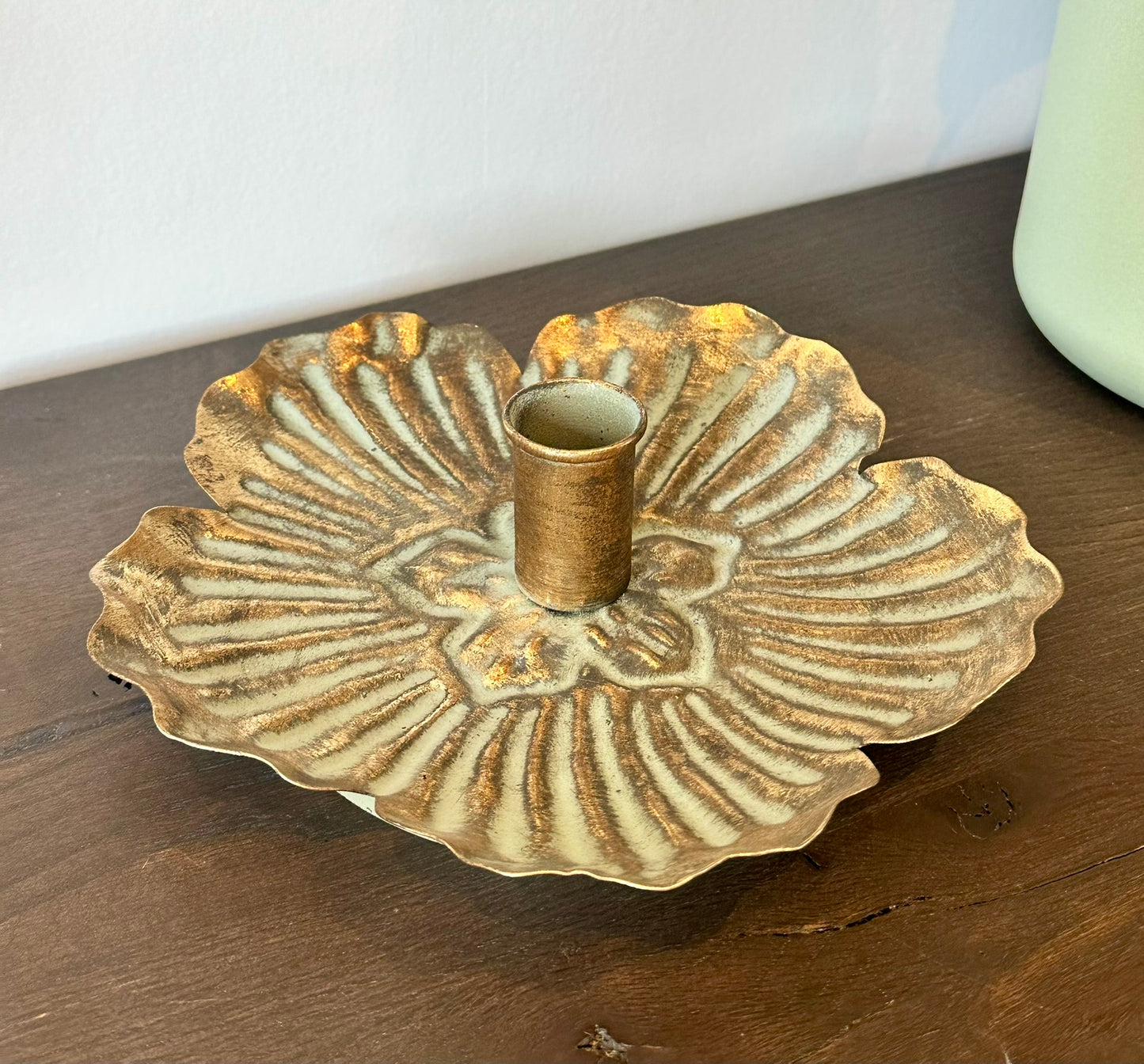 Antique-style flower-shaped metal candle holder with gold patina finish