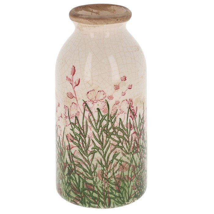 Decorative vase with pink and green floral design and natural ceramic top on a white background
