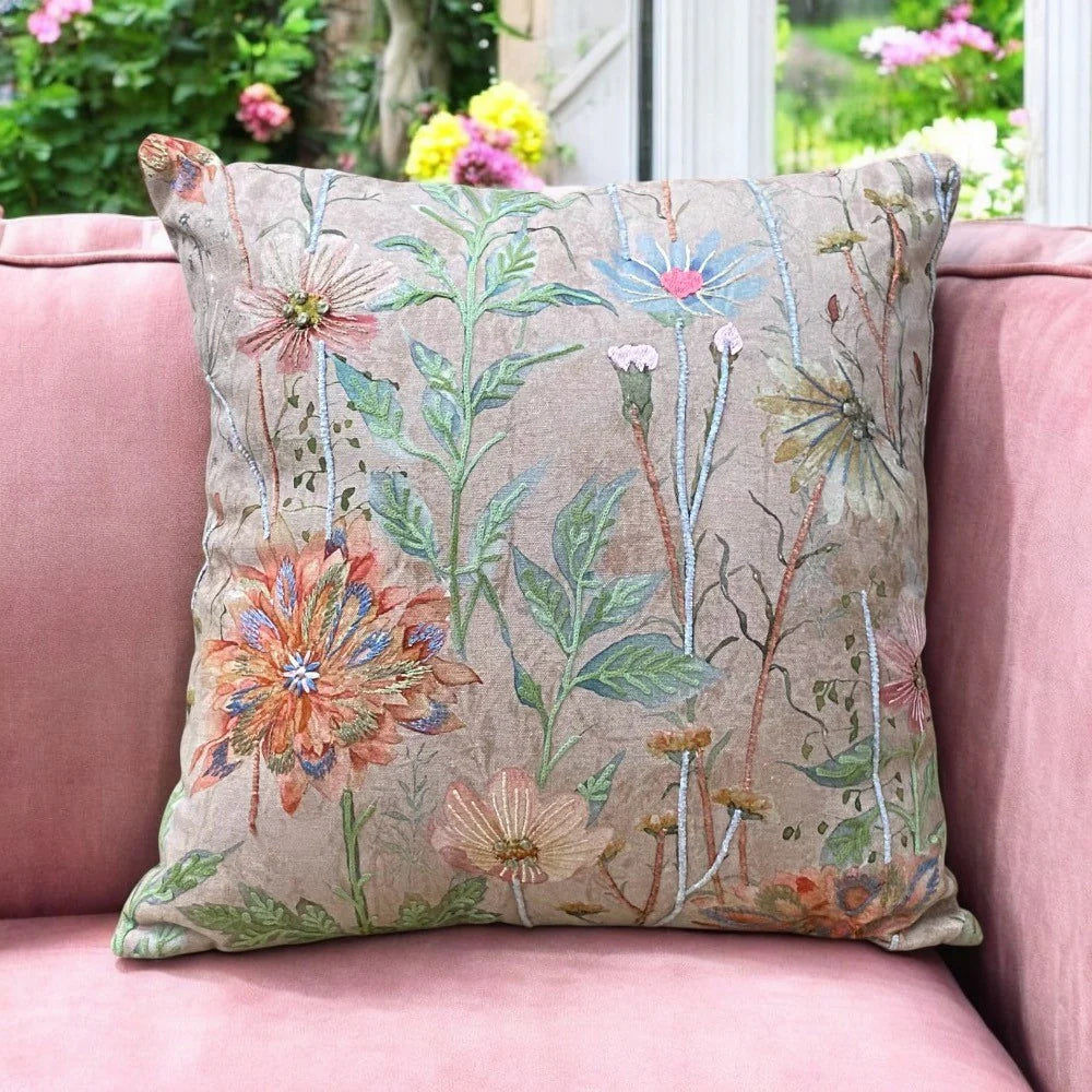 Decorative cotton throw pillow featuring colourful stitched flowers, ideal gift for nature lovers and vintage-style home accents.