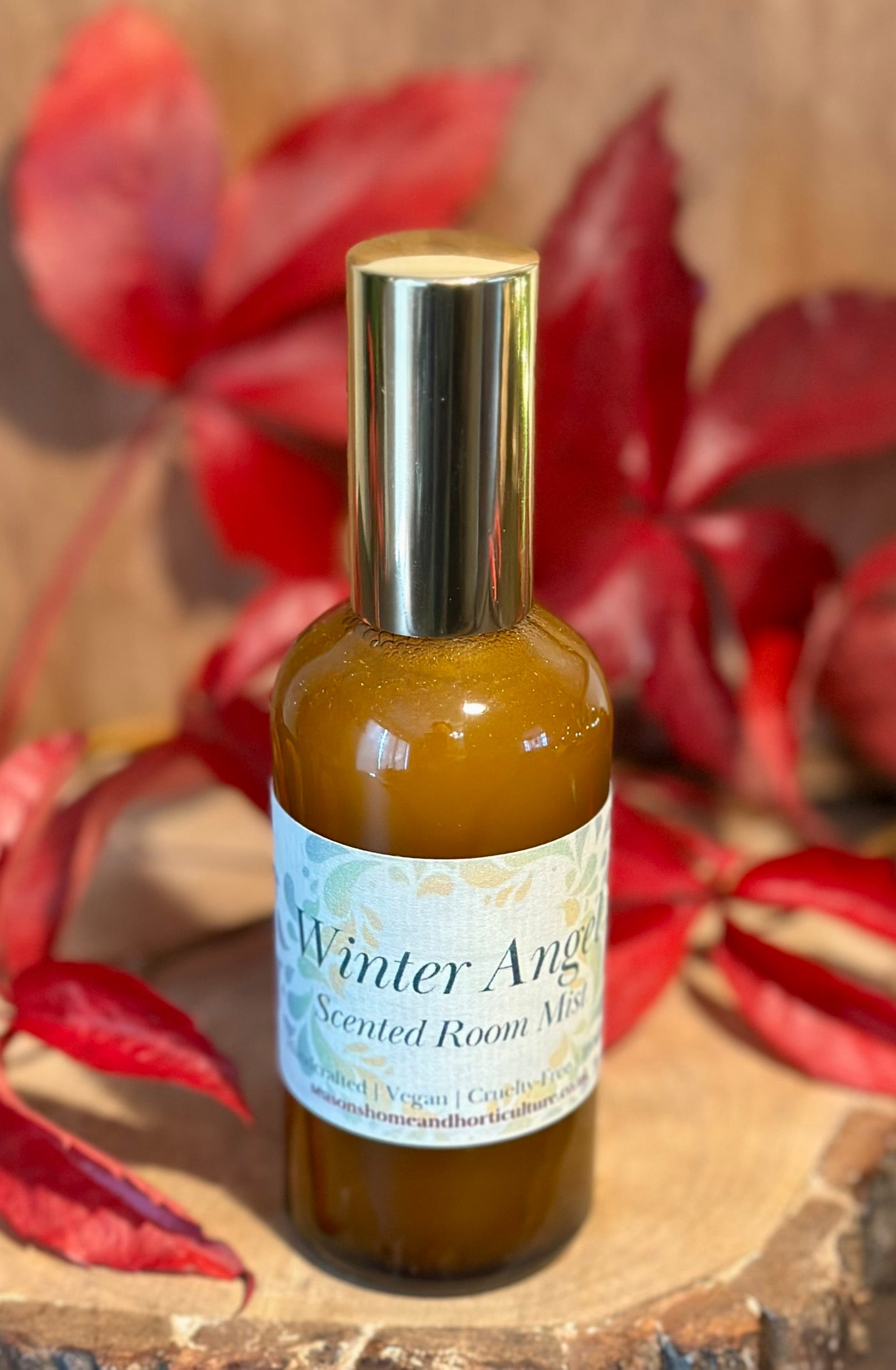 Winter Angel room mist with jasmine, amberwood, and saffron scent, vegan and cruelty-free festive home fragrance spray.