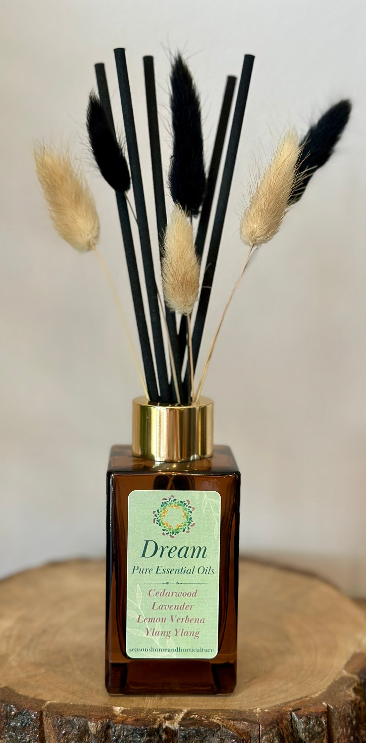Dream diffuser with cedarwood and ylang-ylang essential oils, vegan cruelty-free natural calming home fragrance.