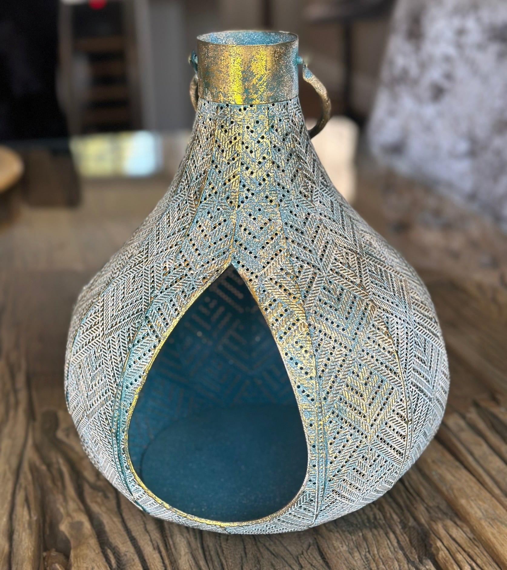 the blue lantern, brushed with gold detailing. 