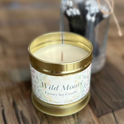 Handcrafted Wild Moors tin candle, warm earthy scent of bergamot and cedarwood, vegan and sustainable luxury candle gift