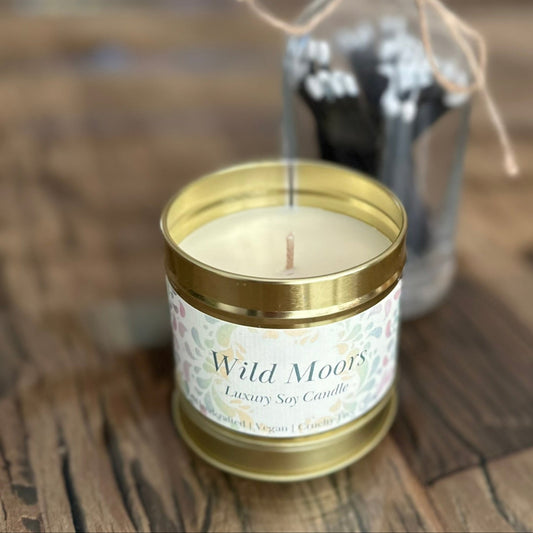 wild moors candle in gold tin