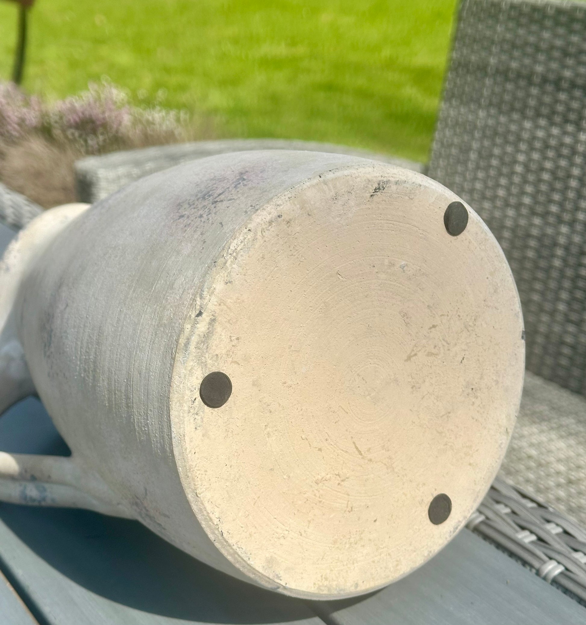 the base of the stoneware jug, featuring foam stoppers 