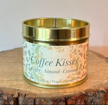 Handmade Coffee Kisses tin candle scented with coffee, almond and caramel in gold container on wooden surface