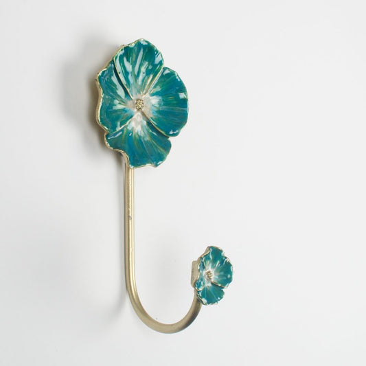 Decorative brass effect flower hook with enamel turquoise cornflower blue design on a white background