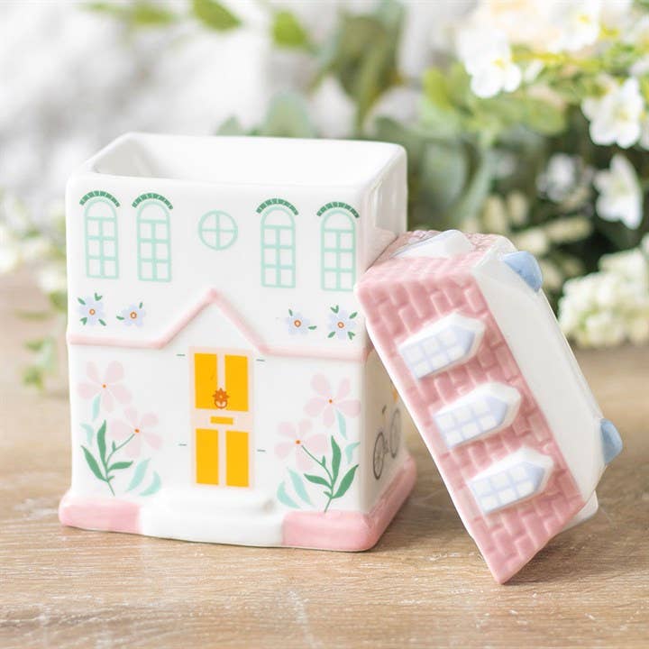 Decorative ceramic house oil burner in pink and white with floral design for wax melts and fragrance oils