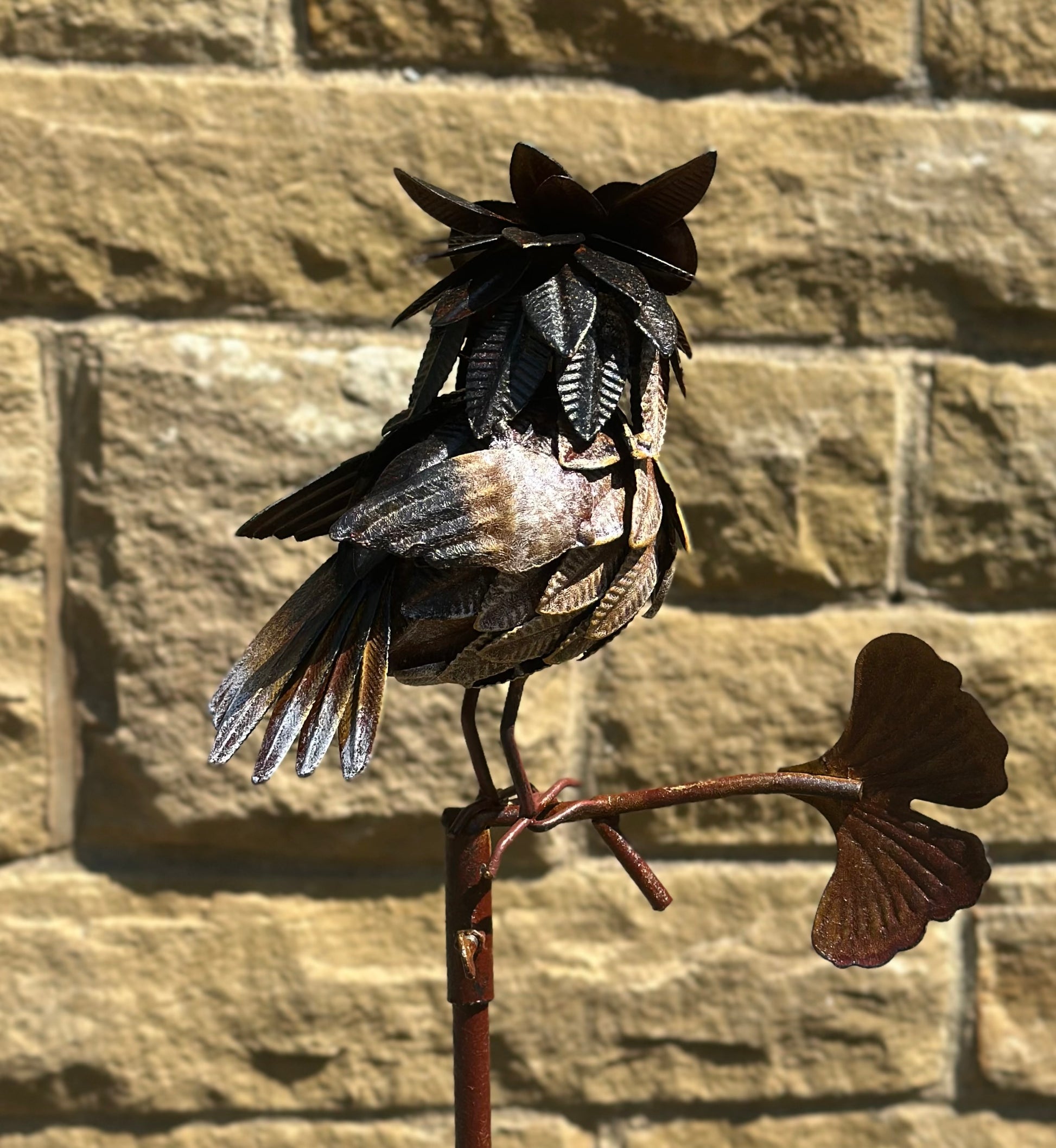 Decorative owl plant stake in weathered metal finish for country garden decoration and wildlife inspired outdoor display
