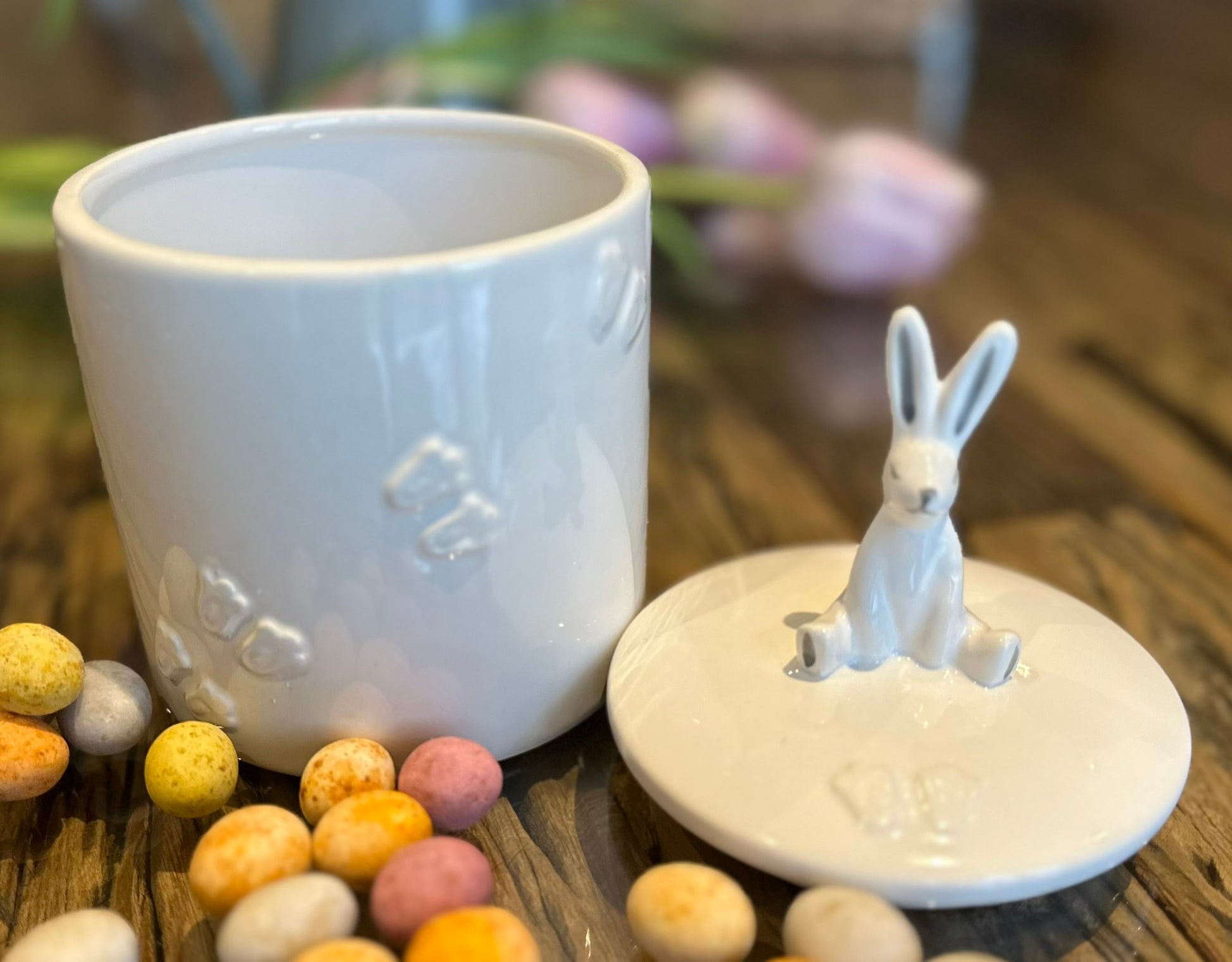 a crisp white cookie jar with a lid showcasing a ceramic 3D bunny rabbit