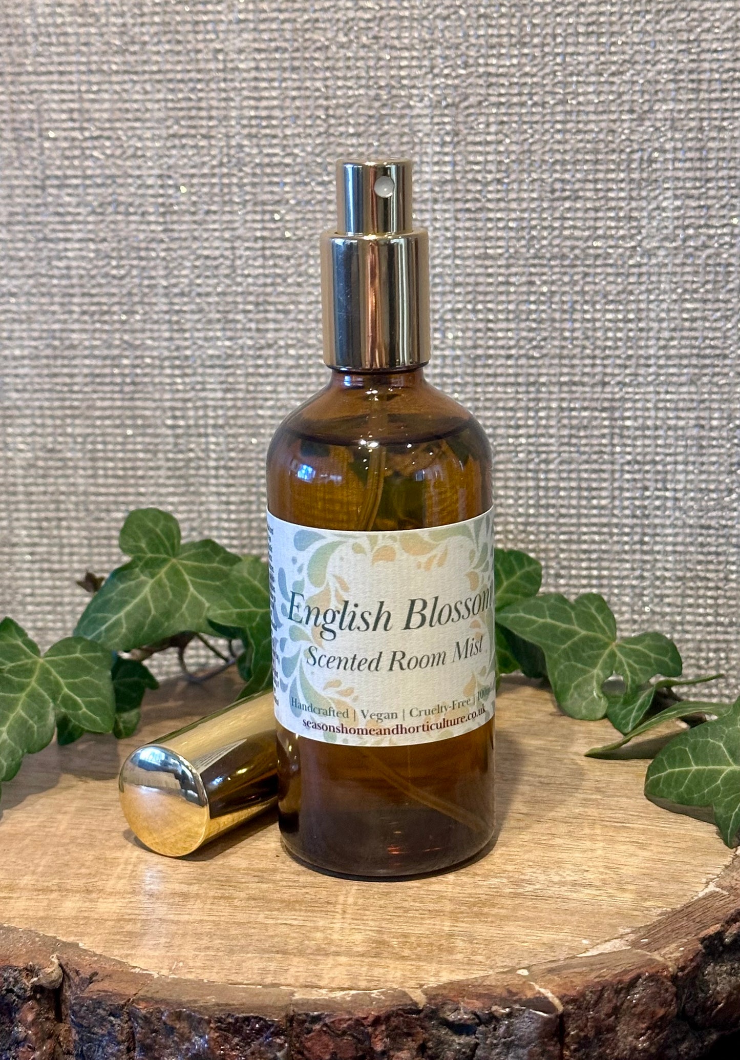 english blossom room mist in an amber spray bottle with peony, jasmine, and amber notes, perfect for floral home fragrance, spring scent, and thoughtful gift ideas