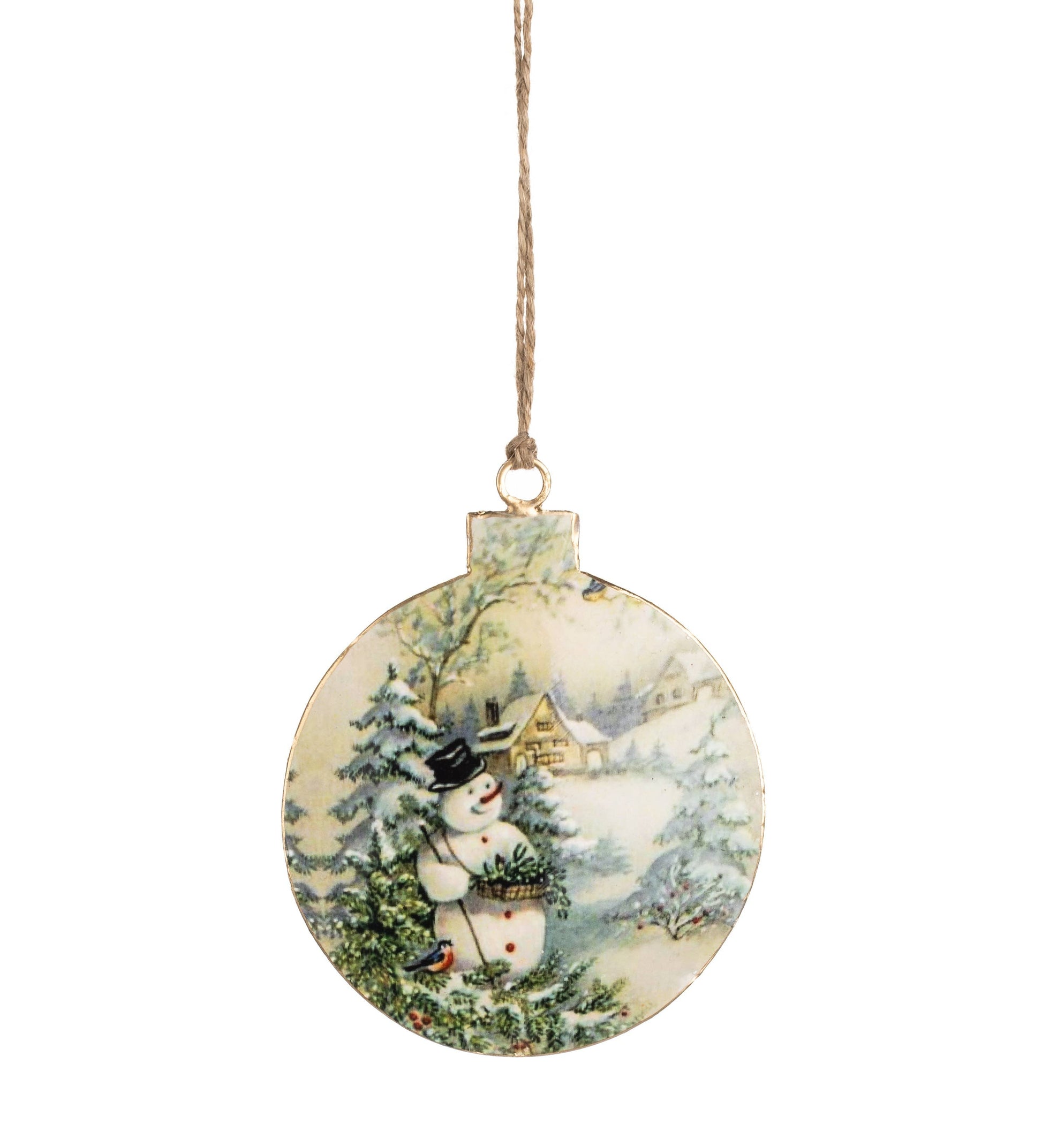 A round Christmas ornament featuring a painted winter scene with a snowman, evergreen trees, and a small house, hanging from a thin string against a plain white background.