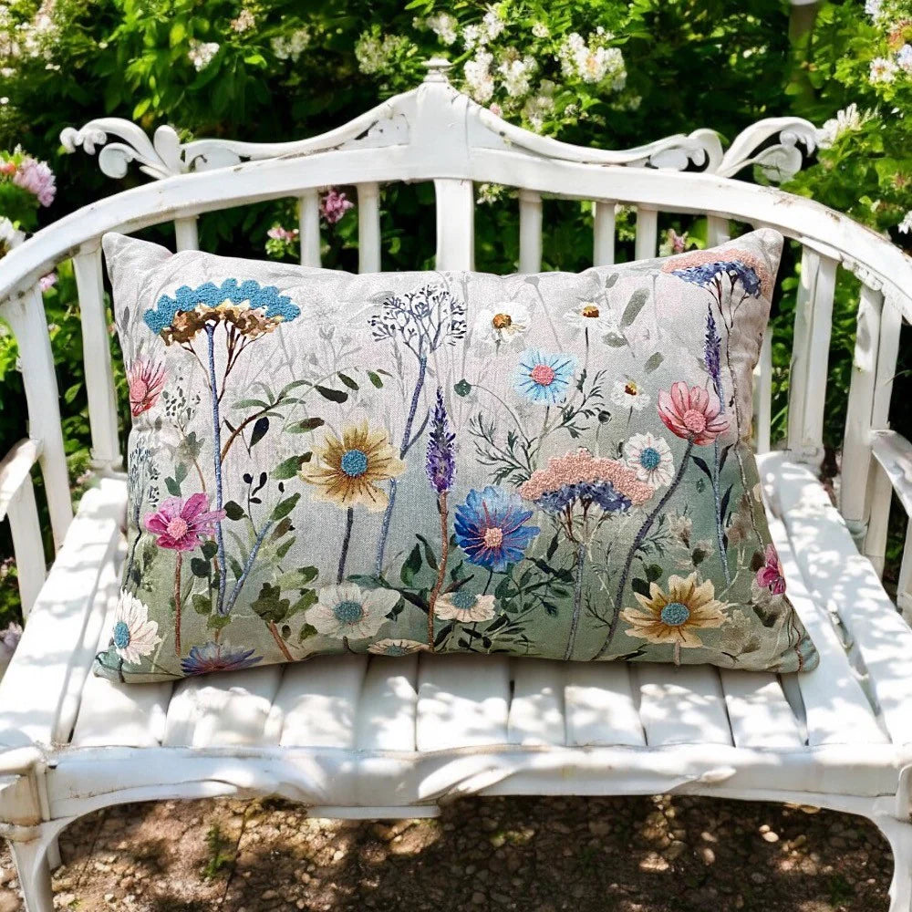 Botanical flower print throw pillow with colourful meadow design for cosy cottage inspired interiors