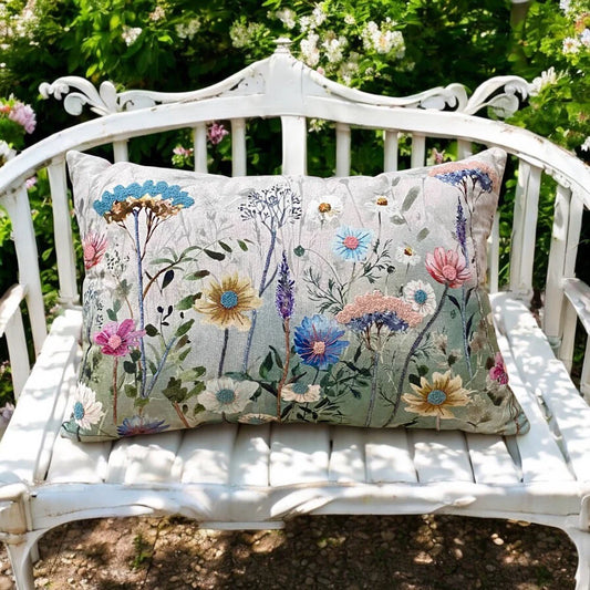 Botanical flower print throw pillow with colourful meadow design for cosy cottage inspired interiors