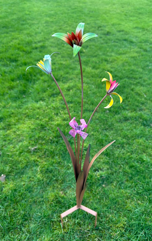 Decorative metal flower sculpture on grass