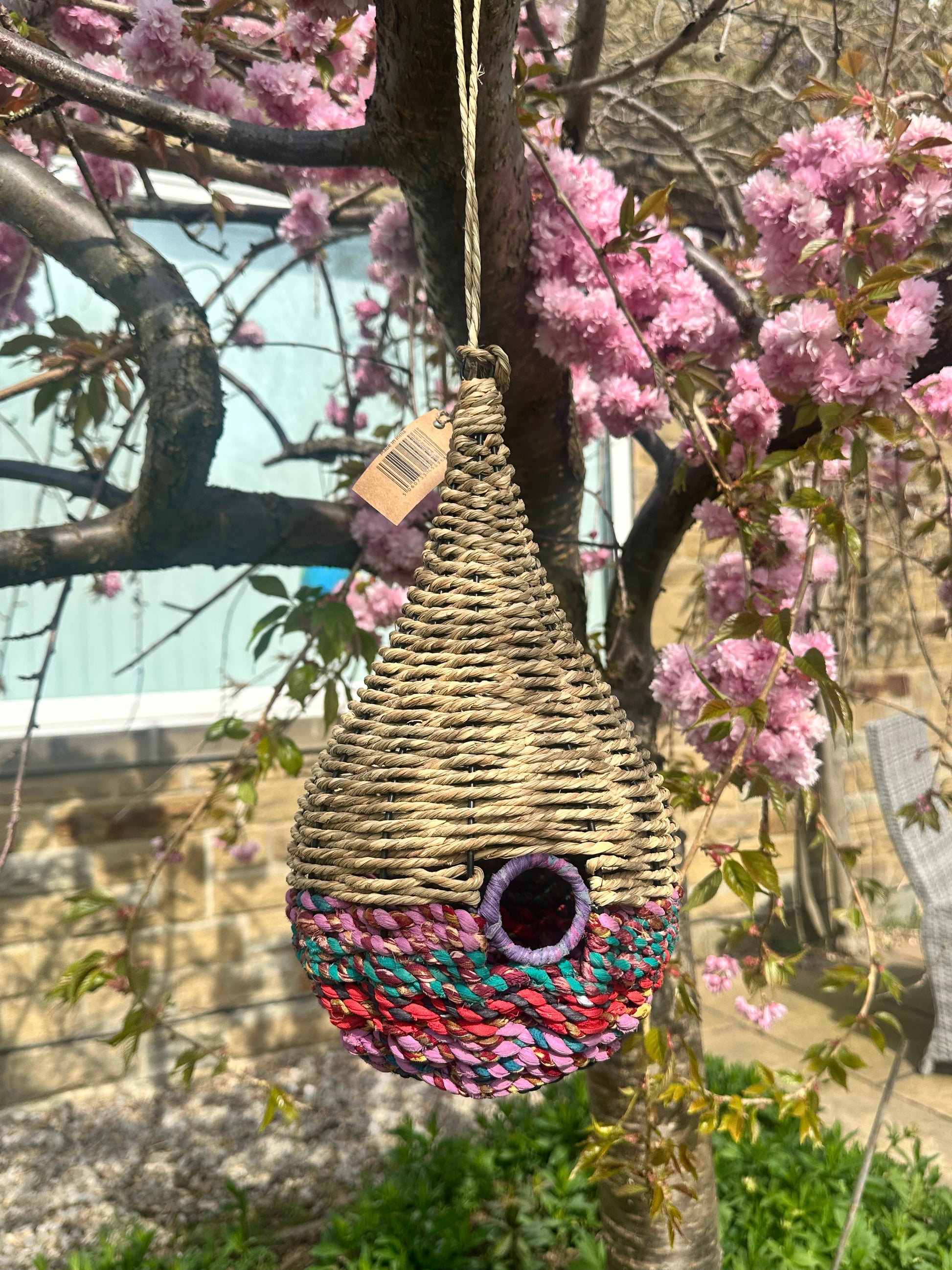 bird feeders made of munja grass and reclaimed sari