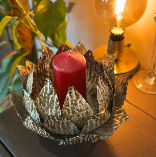 Elegant gold leaf candle holder with white detail for stylish modern home decor

