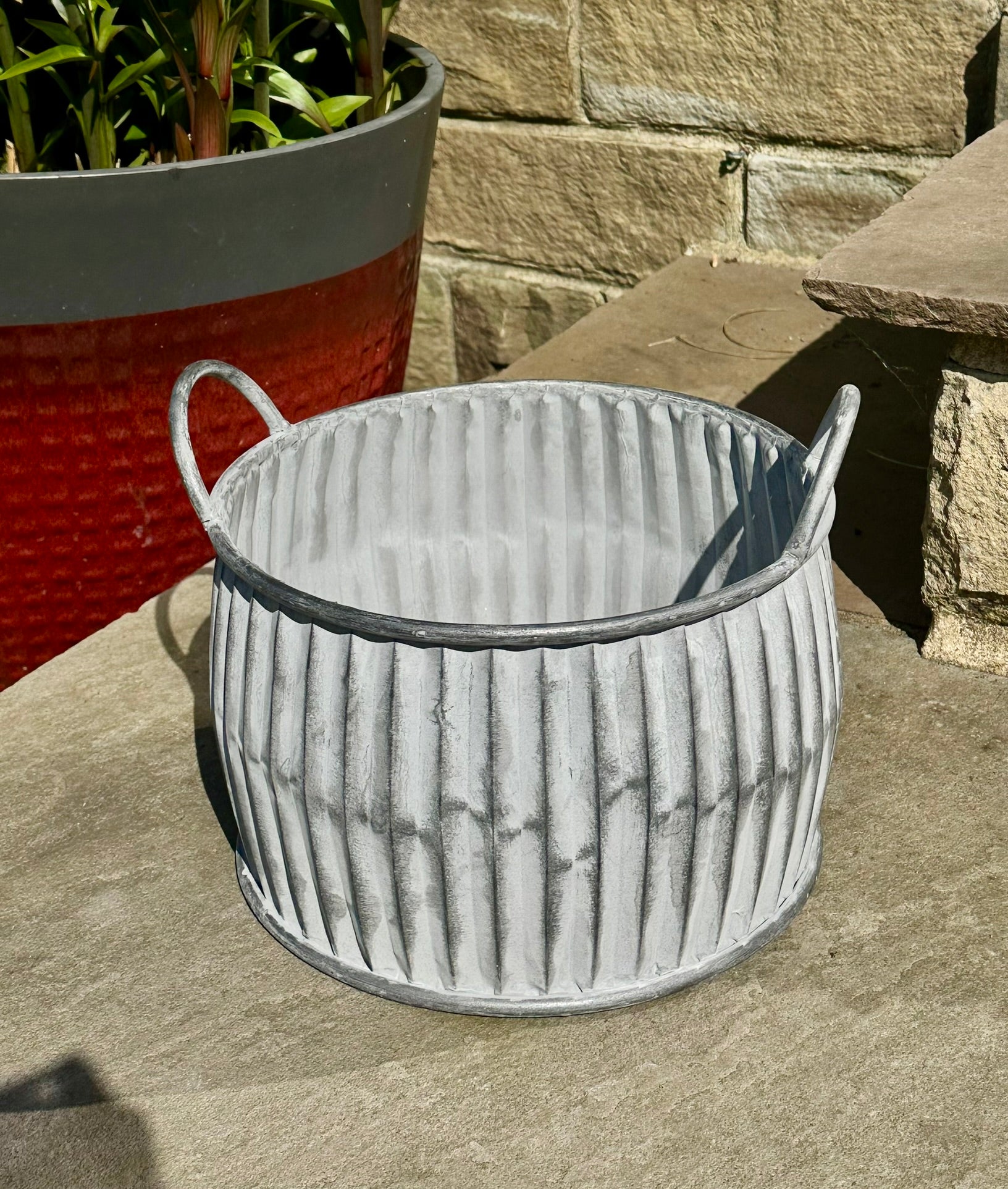 circular grey ribbed planter