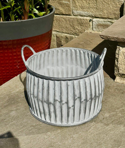 circular grey ribbed planter