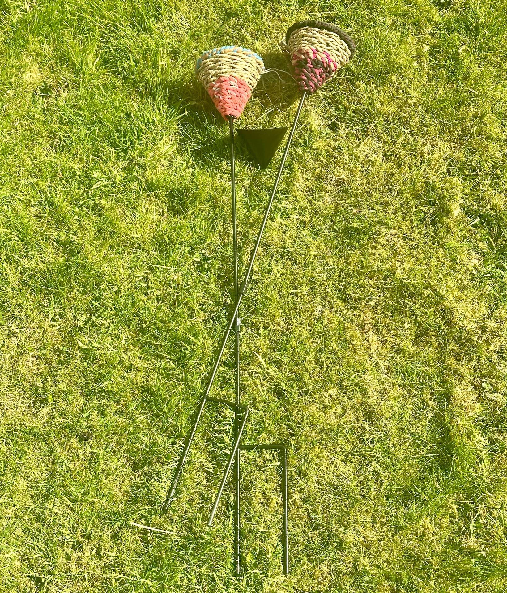 the feeders on grass showing the length and end point of the stake (two-prong)