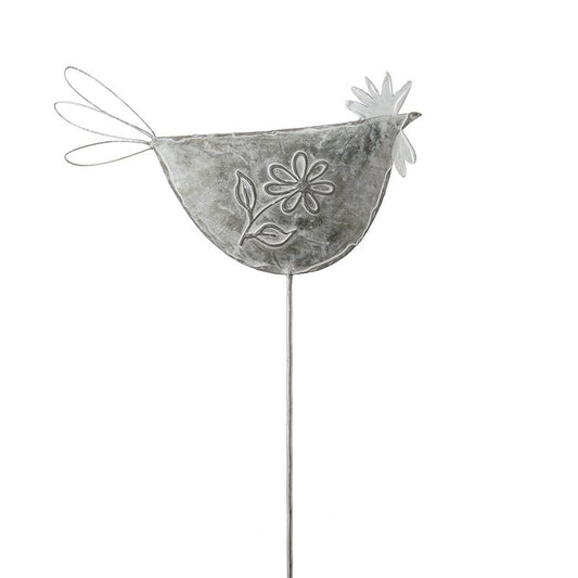 Decorative metal chicken figure with floral design on a white background