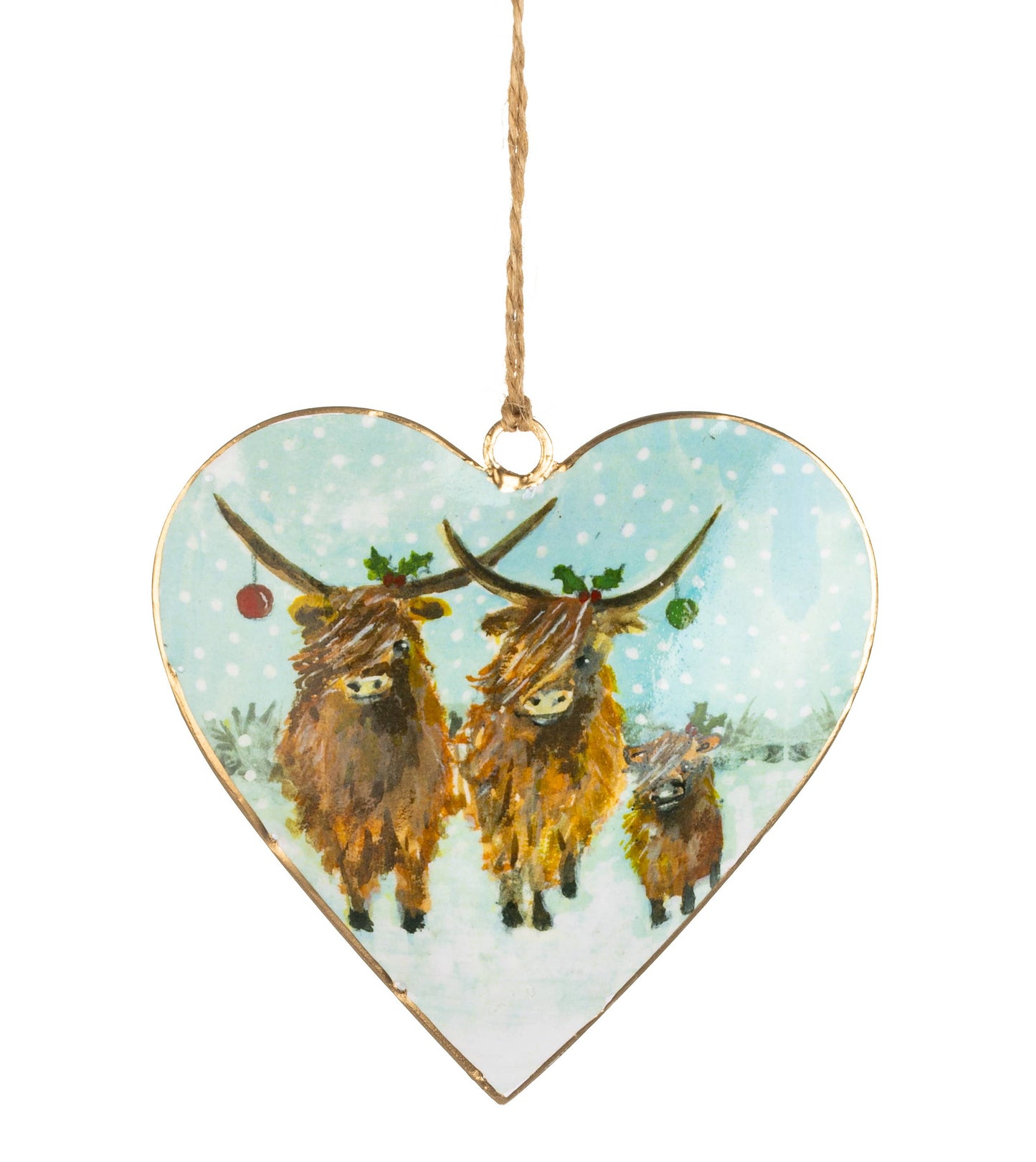Heart-shaped hanging ornament with a printed illustration of three Highland cows in a snowy scene, suspended by a twine loop on a white background.