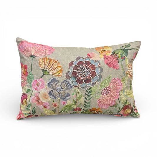 Floral patterned cushion embroidered  on a white background
