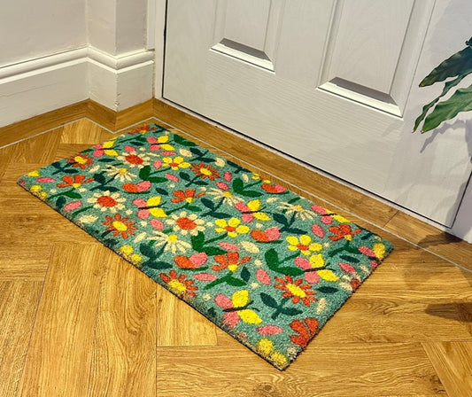 staged image of the vibrant floral doormat