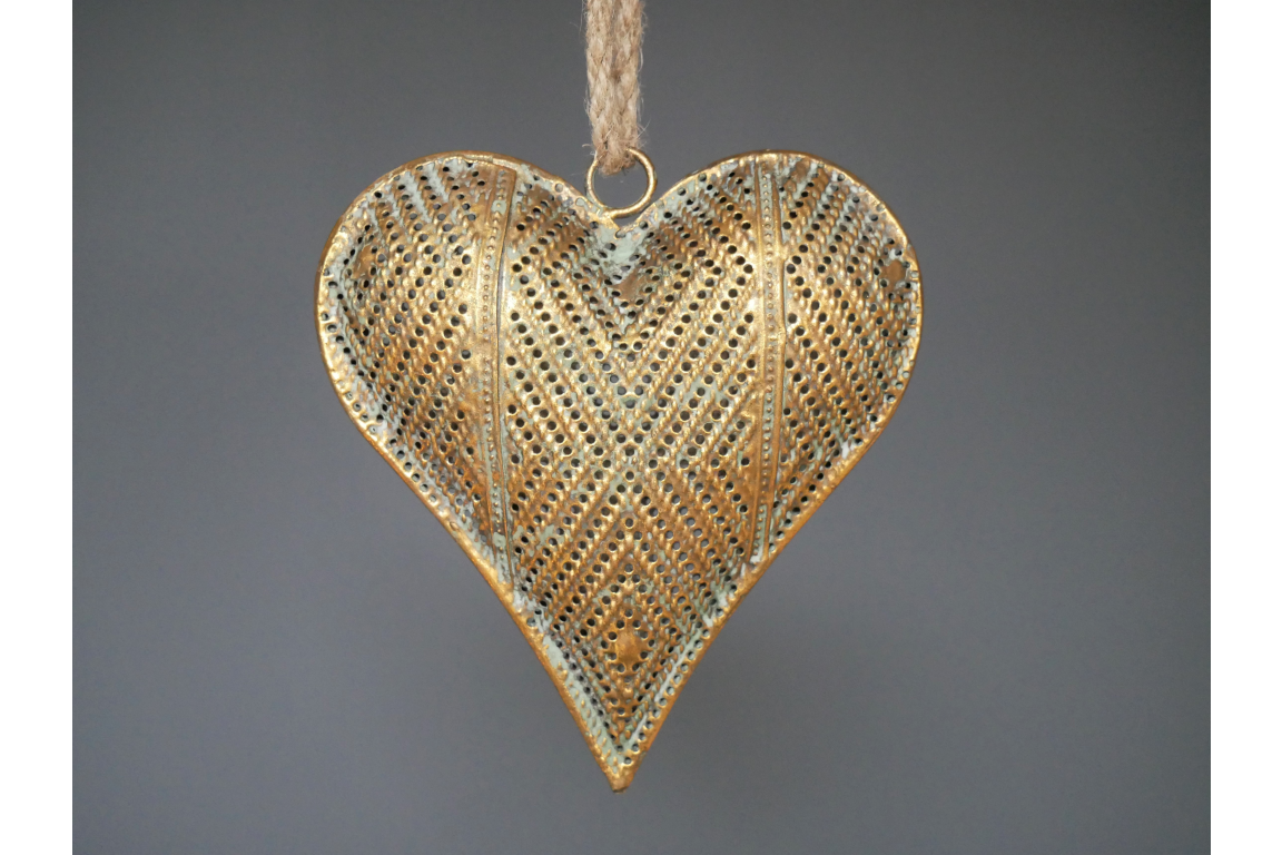 the intricate heart decoration hanging from a rope.