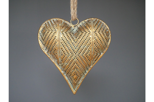 the intricate heart decoration hanging from a rope.