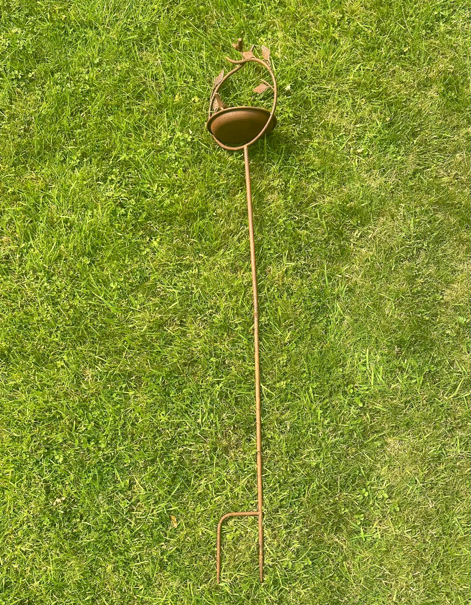 Ornamental garden birdbath on tall stake 