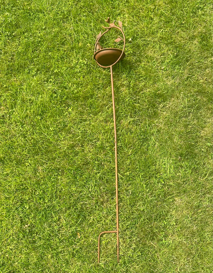 Ornamental garden birdbath on tall stake 