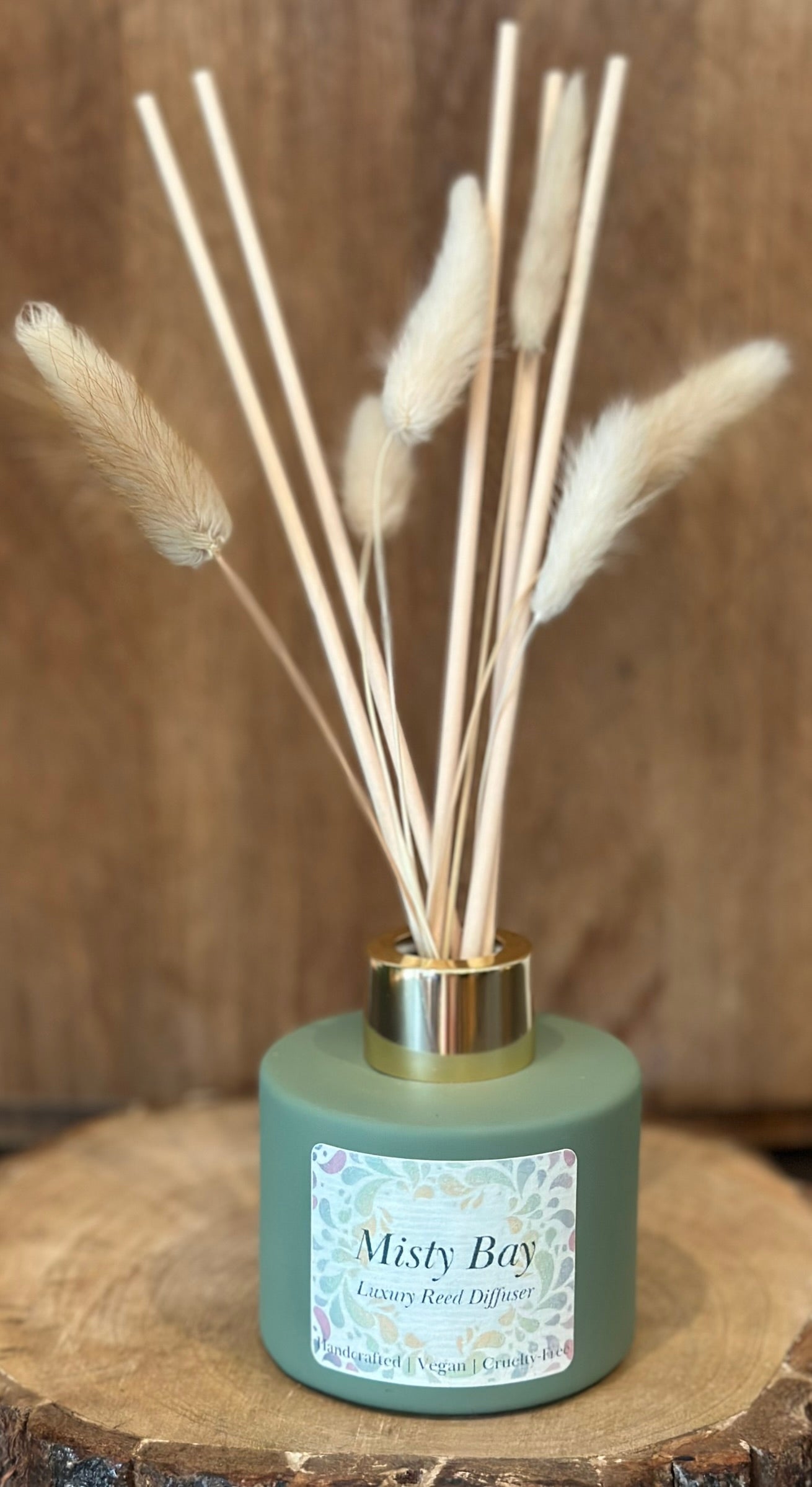 Misty Bay luxury reed diffuser with bunny tails, vegan and cruelty-free, coastal amber and driftwood home fragrance in glass bottle.