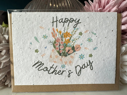 an image of an envelope of flowers bordered with the script of 'happy mother's day' on wildflower seed paper. 