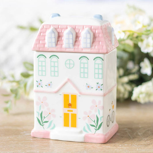 Pastel ceramic house wax melt burner with floral details for cosy home fragrance and cottage style decor