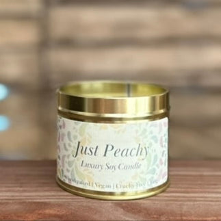 just peachy scented candle in gold tin