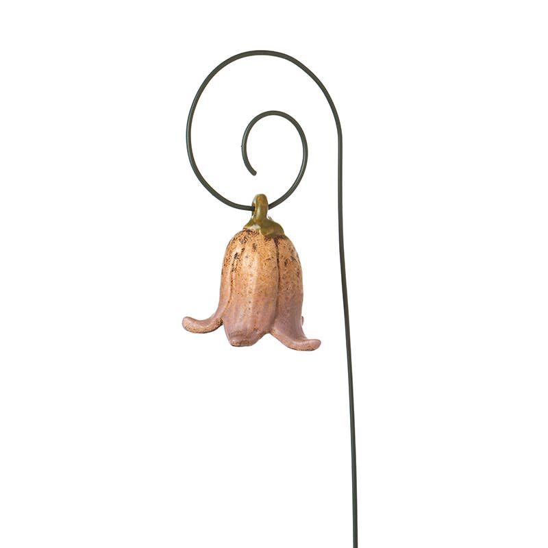 Pink Decorative metal flower with a white background