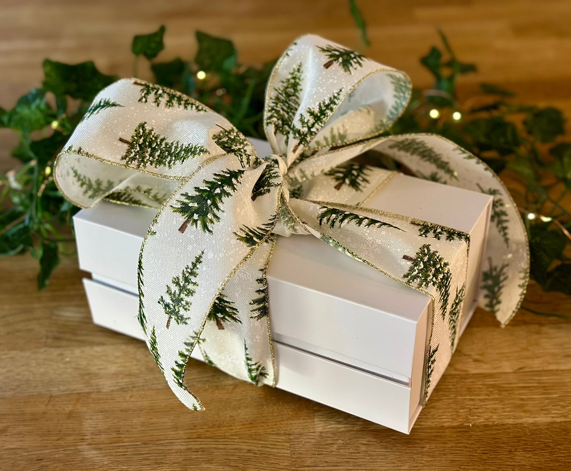 Premium home fragrance duo featuring a soy candle and reed diffuser in festive packaging for gifting occasions.