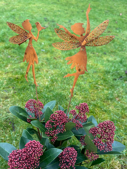 a pair of fairy garden stakes