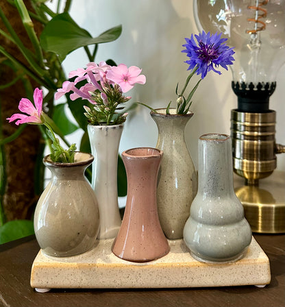 Neutral-tone mini vases on a shared base for rustic display or thoughtful gift

