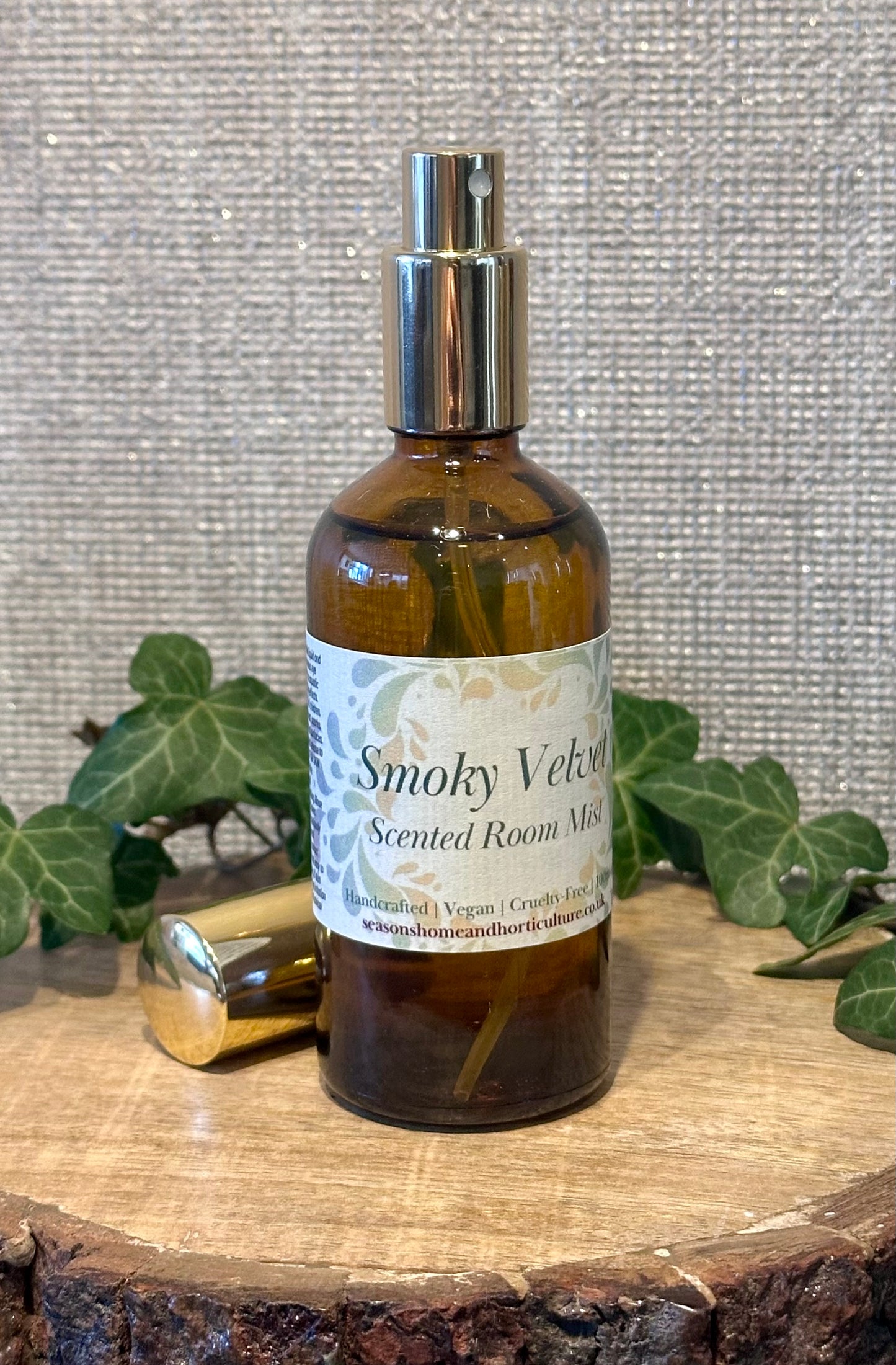 Smokey velvet room mist in an amber spray bottle with honey, spice, and sandalwood notes, creating a warm, cozy home fragrance perfect for gifts and relaxing ambiance