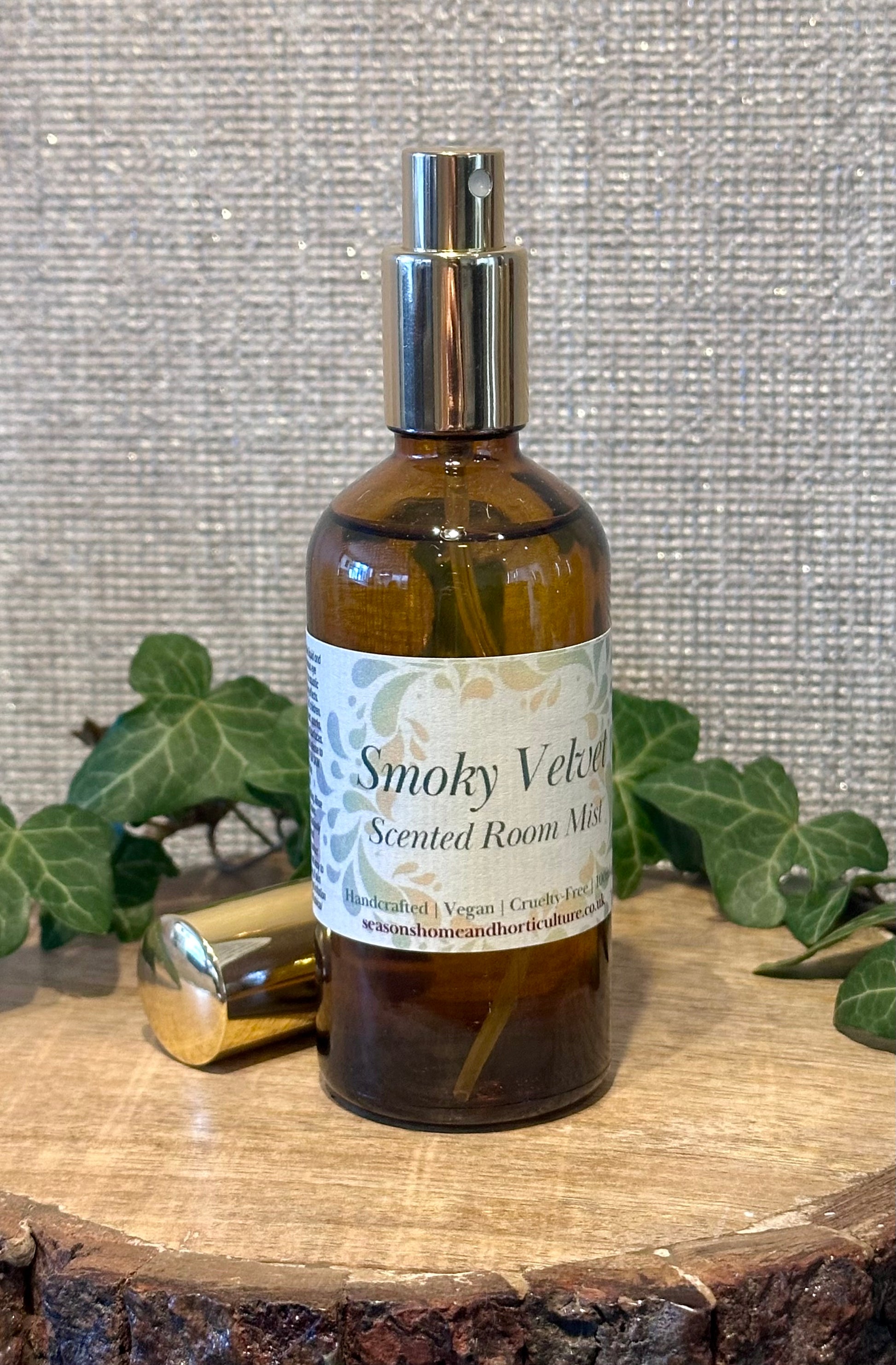 Smokey velvet room mist in an amber spray bottle with honey, spice, and sandalwood notes, creating a warm, cozy home fragrance perfect for gifts and relaxing ambiance